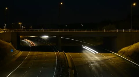 Time lapse traffic crossing over A1/M motorway at night Leeds United Kingdom Stock Footage 12736506