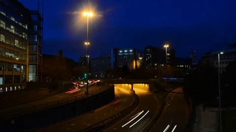 Time lapse traffic driving through leeds city centre at twilight united kingdom Stock Footage 73295821