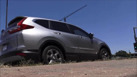 Time lapse traffic in front of skyscraper under construction 8x Stock Footage 76944454