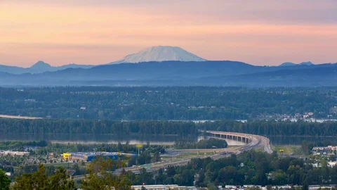 Time lapse of traffic on Glenn Jackson bridge with sunset over Mt. St. Helens 4k Stock Footage 75883802