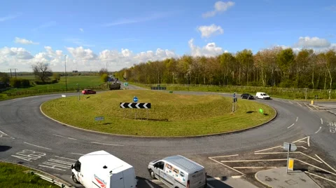 Time lapse traffic going round roundabout selby yorkshire uk Stock Footage 62670571