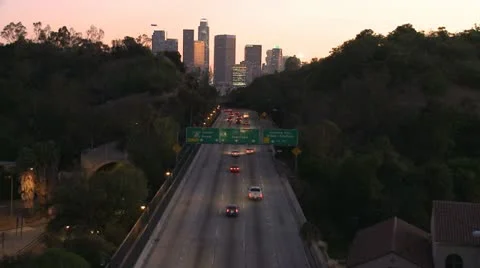 Time Lapse of Traffic heading towards Los Angeles City at Sunset Stock Footage 11978850