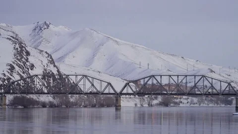 Time lapse of traffic on highway in the background of railway bridge over the Stock Footage 75069178