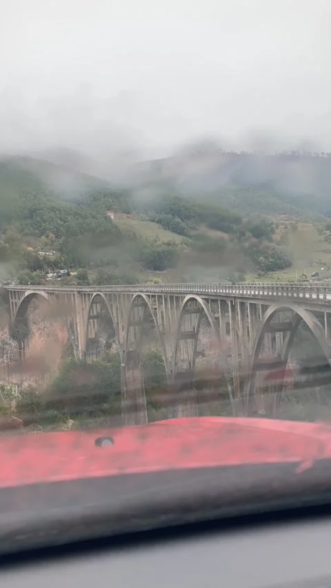 Time lapse of traffic on the old bridge on Djurdjevica Tara Stock Footage 256709065