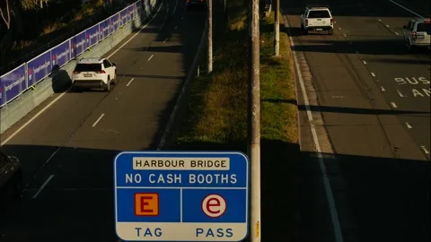 Time lapse traffic passes Harbour Bridge no cash booths sign 4K Stock Footage 244676752