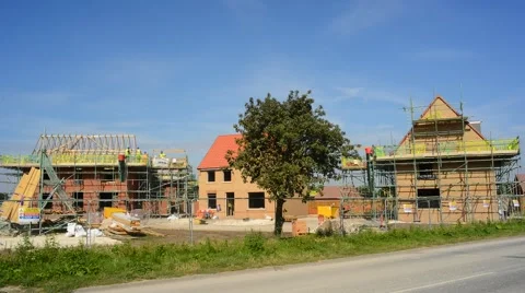 Time lapse traffic passing construction of new houses united kingdom Stock Footage 66534389