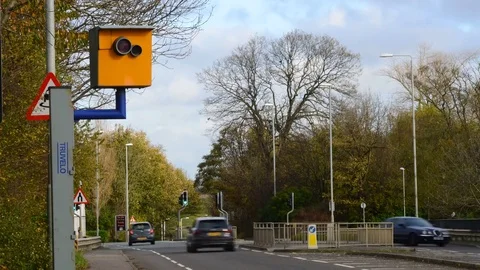 Time lapse traffic passing speed camera leeds yorkshire united kingdom Stock Footage 82931861