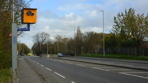 Time lapse traffic passing speed camera leeds yorkshire united kingdom Stock Footage 82931880