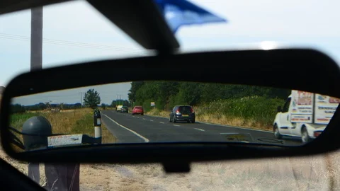 Time lapse traffic reflected in vehicle rear view mirror united kingdom Stock Footage 92845438
