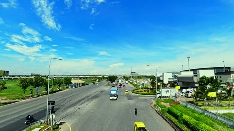 Time lapse of traffic on road in city with sky and clouds. Stock Footage 115302445