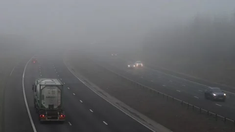 Time lapse traffic travelling through thick fog on the A1/M motorway leeds uk Stock Footage 168885968