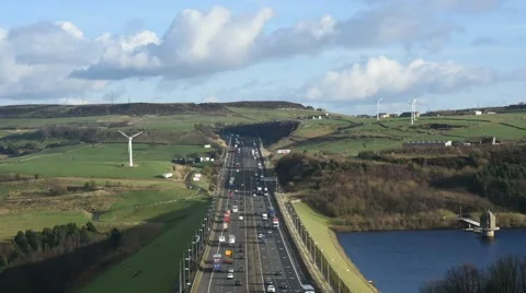 Time lapse traffic by windmills  on m62 motorway united kingdom Stock Footage 59910654