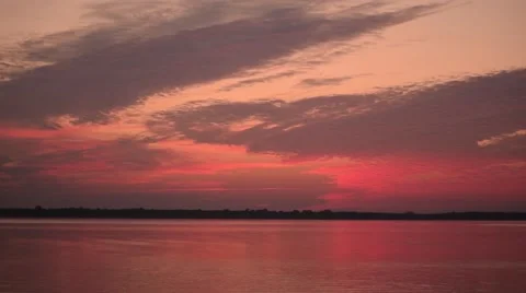 Time lapse of transforming colorful clouds before sunrise Stock Footage 69071133