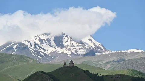 Time-lapse of Trinity Church in Kazbegi Georgia with clouds movement Stock Footage 248637701