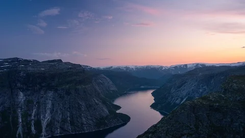 Time lapse of Trolltunga mountain cliff at sunset, Norway Stock Footage 129413496