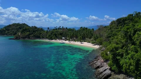 Time lapse Tropical beach with clear water and outrigger boat. Marvelous aerial Stock Footage 344497047