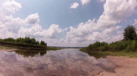 Time lapse, TSummer clouds time lapse reflected on lake Stock Footage 29049642