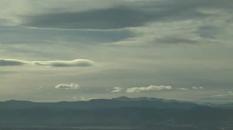 Time Lapse of Turbulent Wave Clouds over Rocky Mountains Stock Footage 54747100