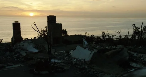 Time-lapse of two burnt chimneys near the sea coast during sunset - 2018 Stock Footage 98955812