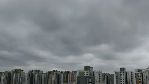 Time lapse of typhoon clouds passing over apartments complex in urban residentia Stock Footage 138133991