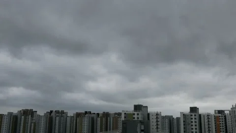 Time lapse of typhoon clouds passing over apartments complex in urban residentia Stock Footage 138134159
