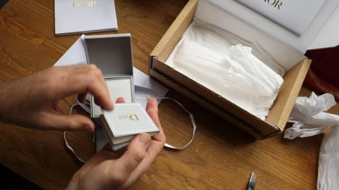 Time-Lapse Unboxing Dior Diamond Ring and Earrings Stock Footage 282103966