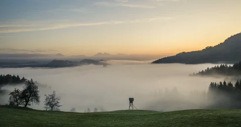 Time lapse valley covered with low clouds on beautiful morning Stock Footage 120479189
