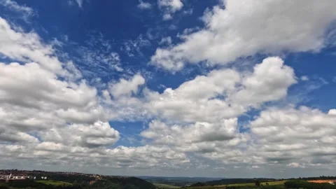 Time lapse of the vast and dynamic blue sky almost entirely filled Stock Footage 330275080