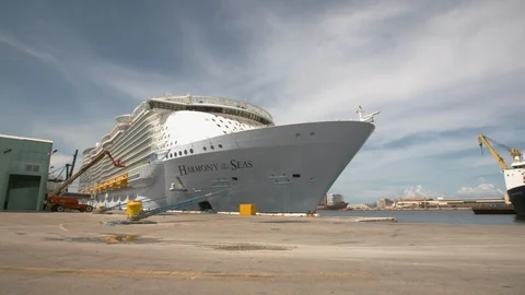 Time-lapse of vehicles moving on a dock near moored cruise ship Stock Footage 117752087