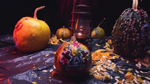 Time-lapse video art scary Halloween pumpkins and an old kerosene lamp Video stock 286208146