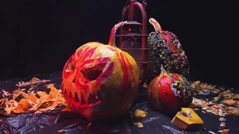 Time-lapse video art scary Halloween pumpkins and an old kerosene lamp Stock Footage 286208150
