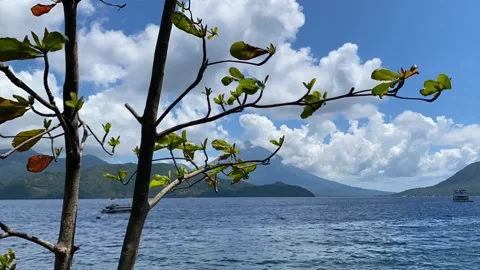 Time lapse video of beach and cloudy blue sky and mountain Stock Footage 289367781
