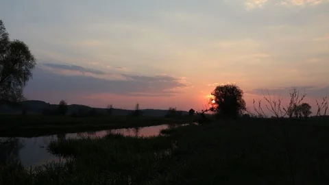 Time lapse video, Beautiful early spring river sunset landscape. Stock Footage 110708203