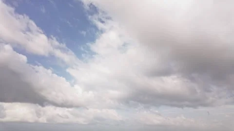 Time lapse video of beautiful white clouds moving fast in blue sky Stock Footage 340253919