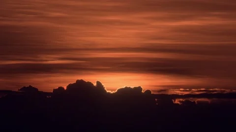 Time-lapse video of the big sun rising through clouds Stock Footage 257055962