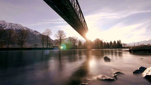 Time lapse video of bridge river landscape scenery at sunset Stock Footage 72862630