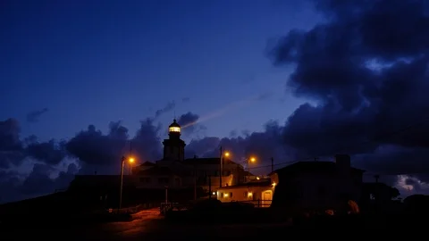 Time-lapse video of Cabo da Roca Lighthouse at cloudy dramatic sunrise, Portu Stock Footage 108096346