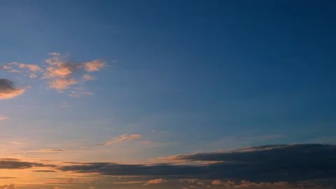 A time-lapse video captures a sunset sky. Stock Footage 314096050