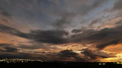 Time-lapse video capturing the movement of dense clouds from sunset Stock Footage 331046879