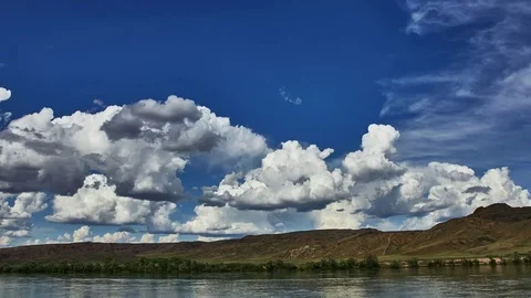 Time lapse video of cloudly weather of Ili river near Almaty, Kazakhstan. Summer Stock Footage 70894418