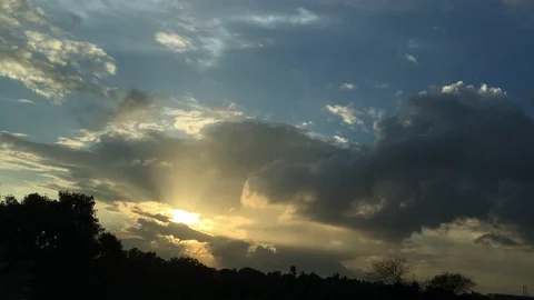 Time lapse video of clouds and setting sun Stock Footage 98574330