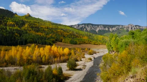 Time lapse video of clouds, mountains and big blue skies on a crisp autumn day. Stock Footage 55495391