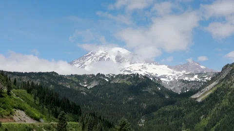 Time lapse video of clouds moving around the peak of Mount Rainier Stock Footage 194761214