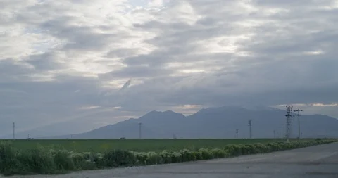 Time lapse video of clouds over crop field. Stock Footage 90979242