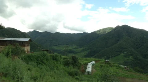 Time lapse video of clouds rolling by the farm in the highland Video stock 35408596