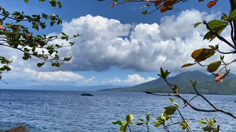 Time lapse video of cloudy blue sky and beautiful beach and mountain Stock Footage 289367823