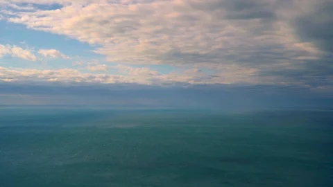 Time lapse video of cloudy sky moving fast over the sea with strong wind Stock Footage 99642570