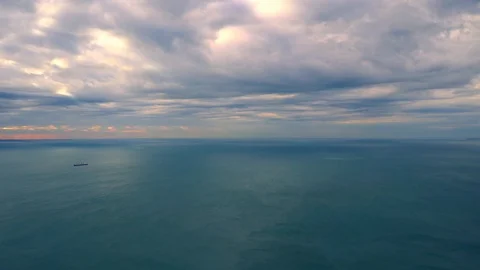 Time lapse video of cloudy sky moving fast over the sea with strong wind Stock Footage 99642874