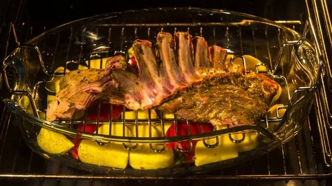 Time lapse video of  cooking  lamb chops in oven Stock Footage 70434255