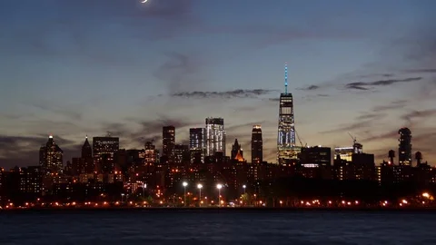Time-lapse video of the Crescent Moon Setting next to the World Trade Center Stock Footage 80376948
